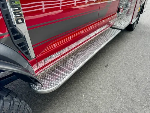Lower side step and rocker-panel close-up with door-open edge visible.